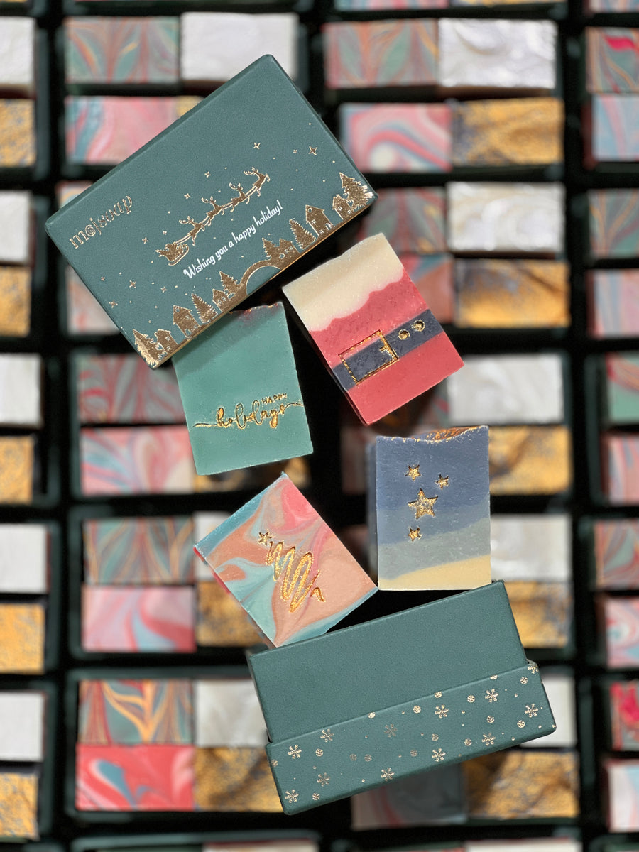 The Winter Wonders gift box, open, with its four winter soaps inside